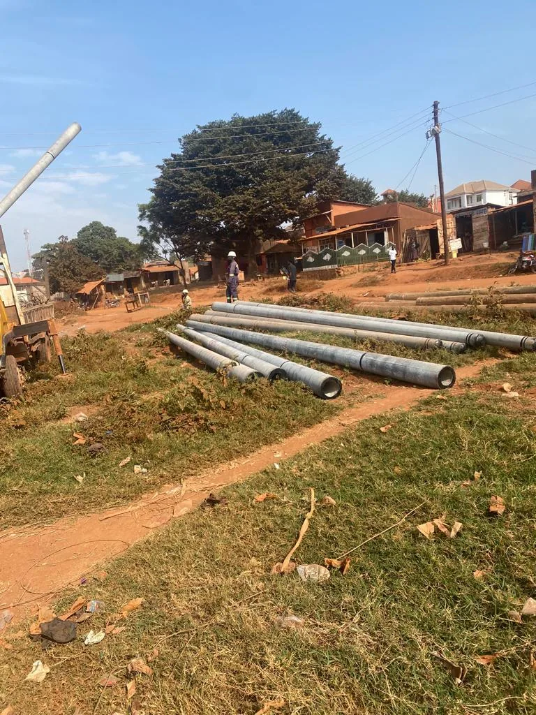 Galvanised steel poles stockpiled for tower erection