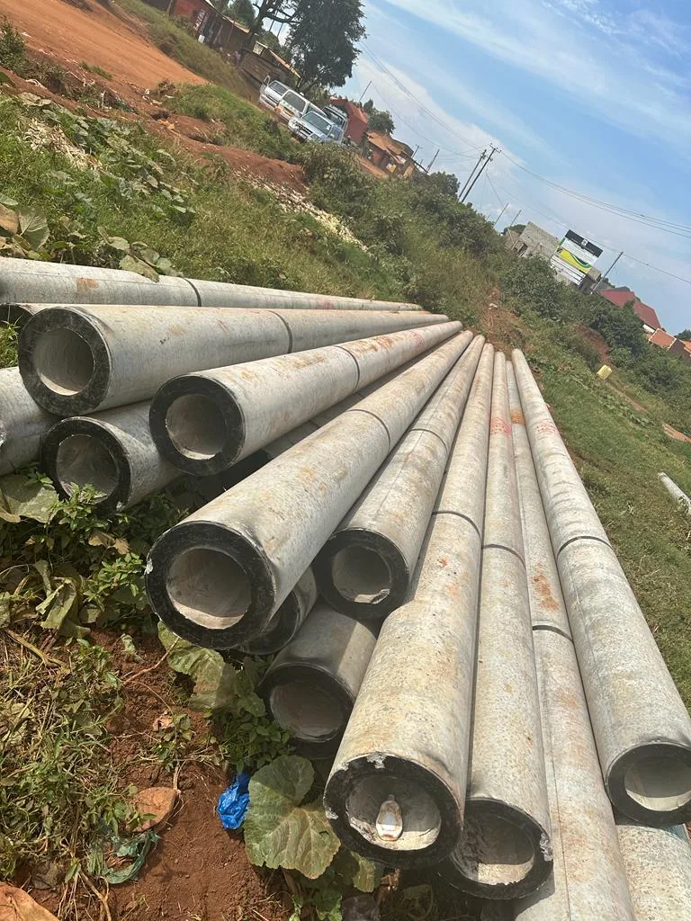 Stockpile of galvanised steel poles ready for power line construction